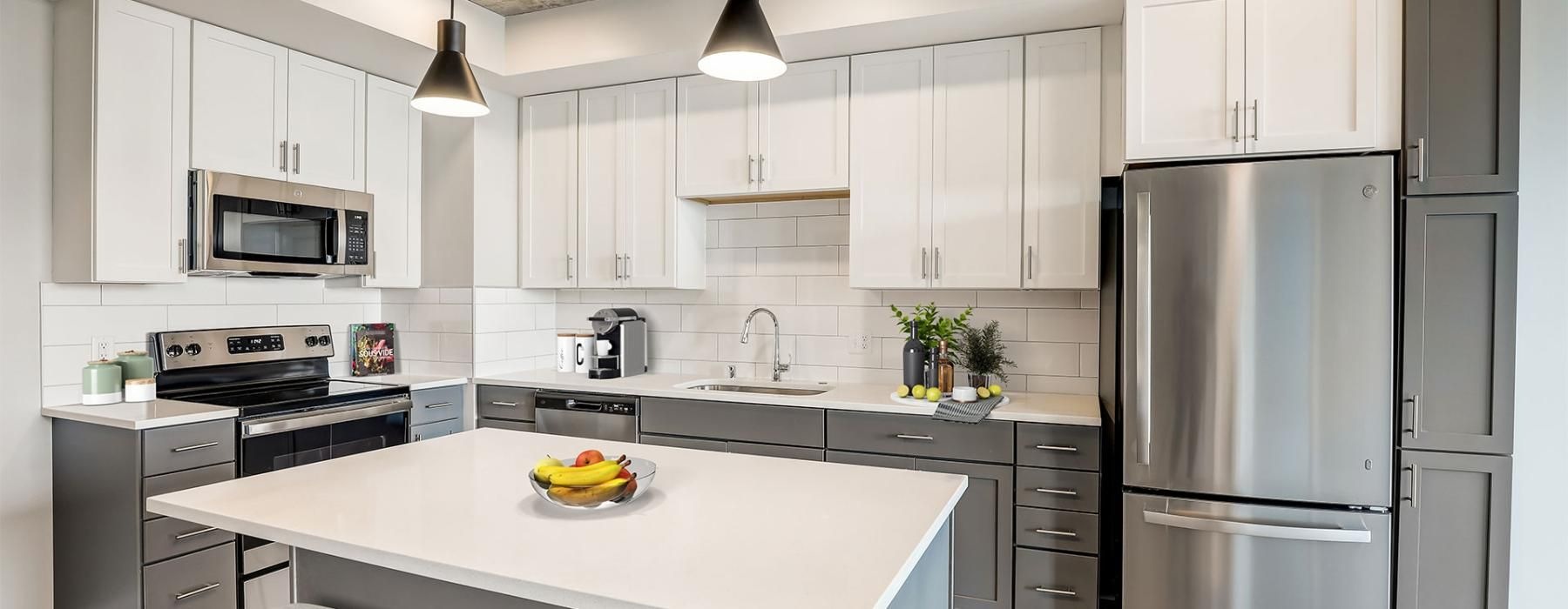 a kitchen with white cabinets