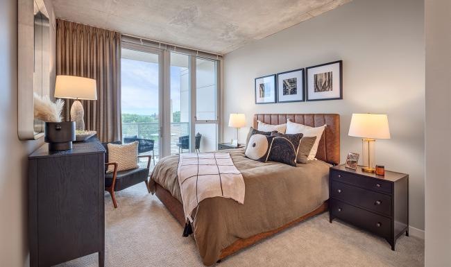 a bedroom with a large window