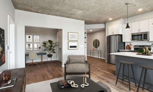 Studio apartment open floor plan with den nook, kitchen island, and hardwood floors